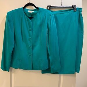 100% Silk jacket and skirt.  Excellent condition.